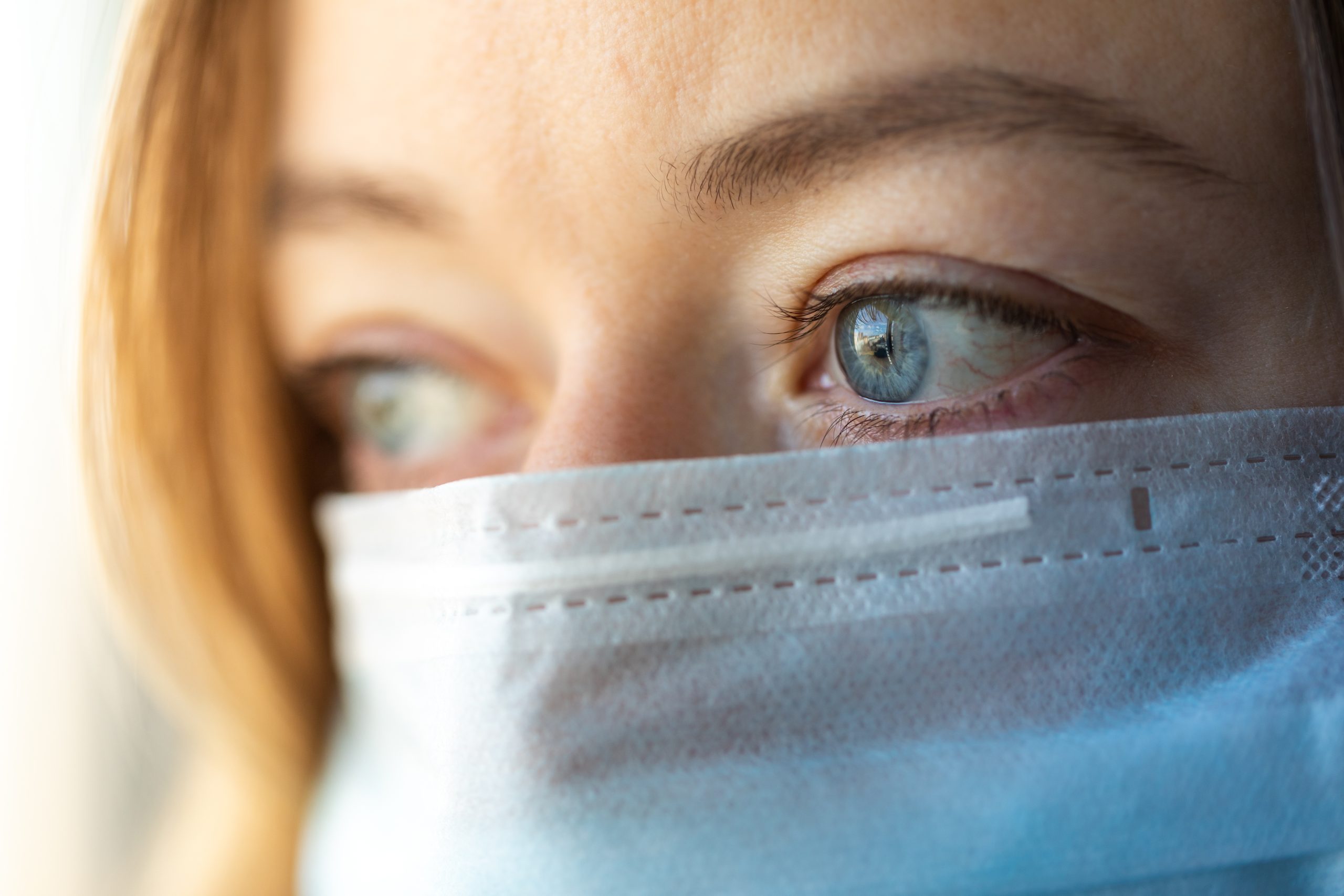 Woman Wearing Medical Mask. Woman With A Blue Medical Mask. Prot